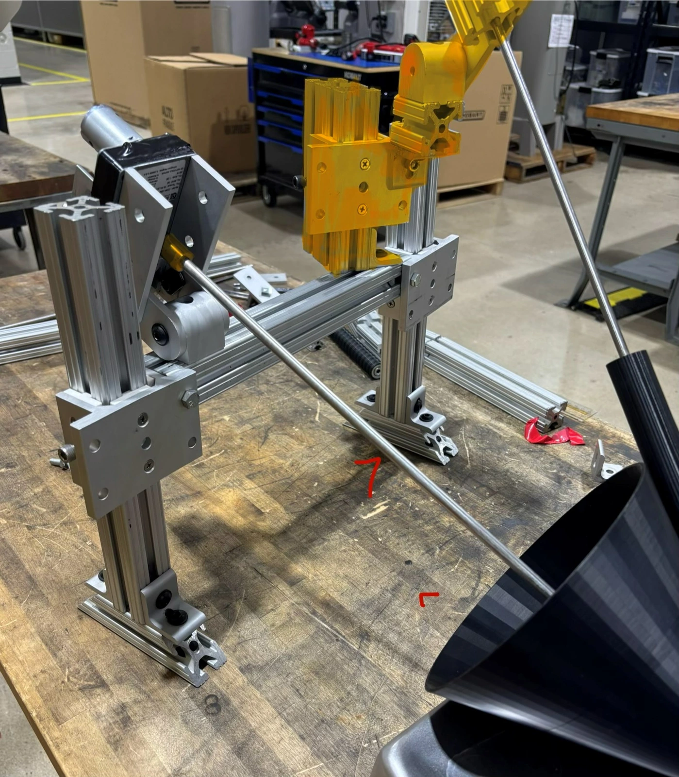 Adjustable test fixture for the cone-and-roller setup.