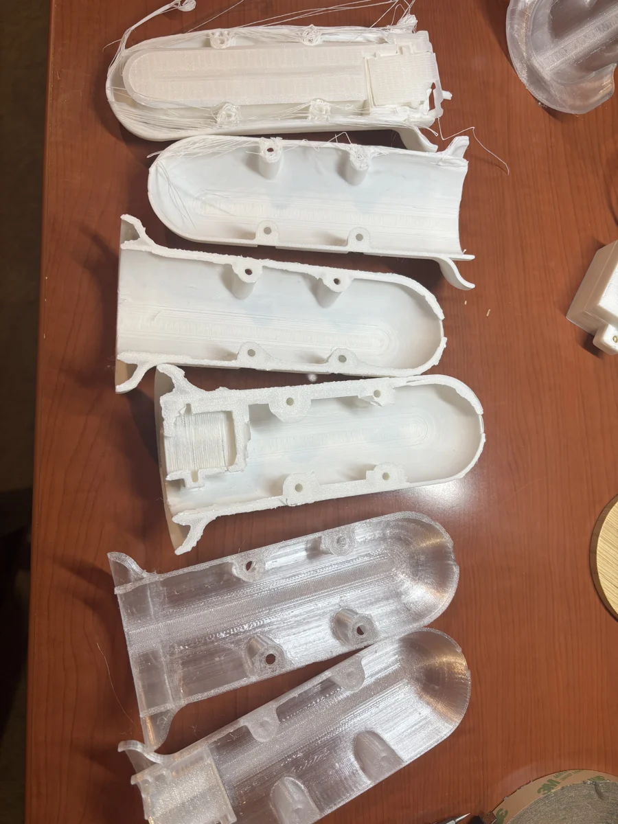 Printed housing iterations from the fabrication process.